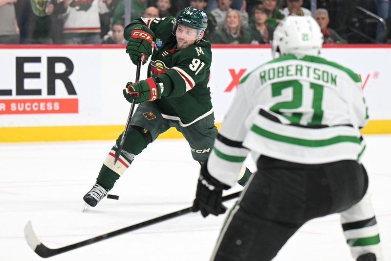 Mar 21, 2026; Saint Paul, Minnesota, USA;  Minnesota Wild forward Vladimir Tarasenko (91) scores an overtime game-winning goal as Dallas Stars forward Jason Robertson (21) looks on at Grand Casino Arena. Mandatory Credit: Nick Wosika-Imagn Images