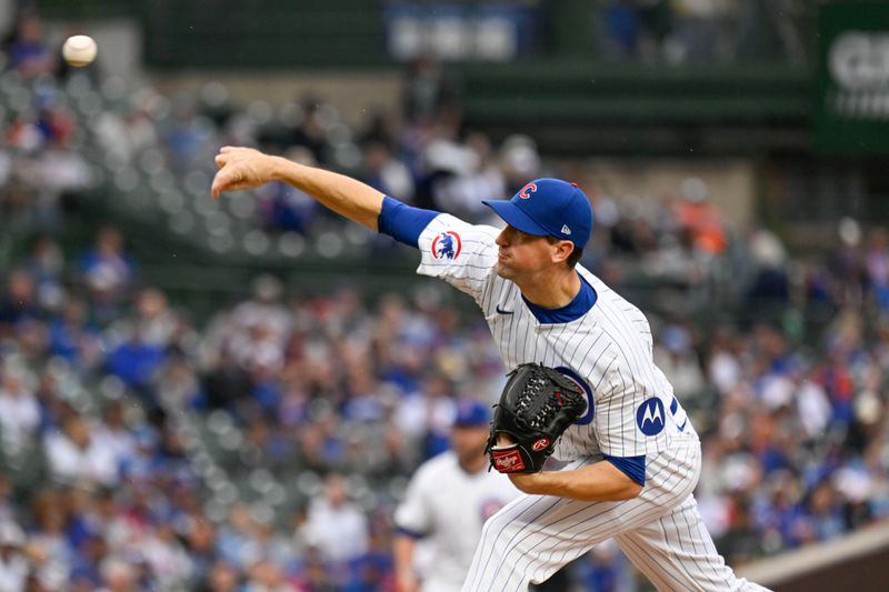 Sep 28, 2024; Chicago, Illinois, USA;  Chicago Cubs pitcher Kyle Hendricks (28) delivers against the Cincinnati Reds during the first inning at Wrigley Field. Mandatory Credit: Matt Marton-Imagn Images