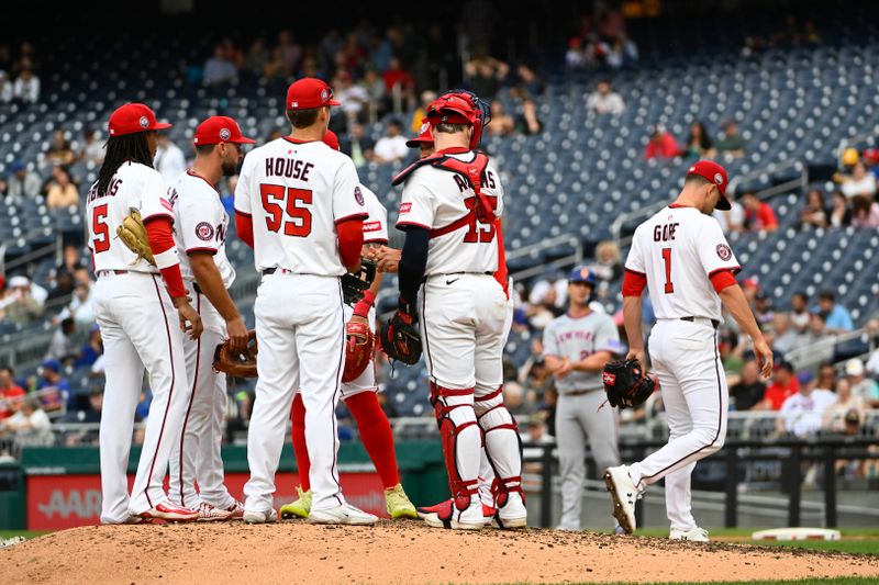 Aug 21, 2025; Washington, District of Columbia, USA; Washington Nationals starting pitcher MacKenzie Gore (1) is removed from the game by interim manager Miguel Cairo (22) against the New York Mets during the fifth inning  at Nationals Park. Mandatory Credit: Brad Mills-Imagn Images