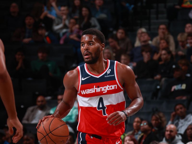 BROOKLYN, NY - OCTOBER 14: Jared Butler #4 of the Washington Wizards dribbles the ball during the game against the Brooklyn Nets during a NBA preseason game on October 14, 2024 at Barclays Center in Brooklyn, New York. NOTE TO USER: User expressly acknowledges and agrees that, by downloading and or using this Photograph, user is consenting to the terms and conditions of the Getty Images License Agreement. Mandatory Copyright Notice: Copyright 2024 NBAE (Photo by Nathaniel S. Butler/NBAE via Getty Images)