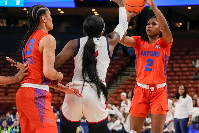 Mar 8, 2024; Greensville, SC, USA; Florida Gators guard Aliyah Matharu (2) shoots guarded by Ole Miss Rebels guard Marquesha Davis (2) during the second half at Bon Secours Wellness Arena. Mandatory Credit: Jim Dedmon-USA TODAY Sports