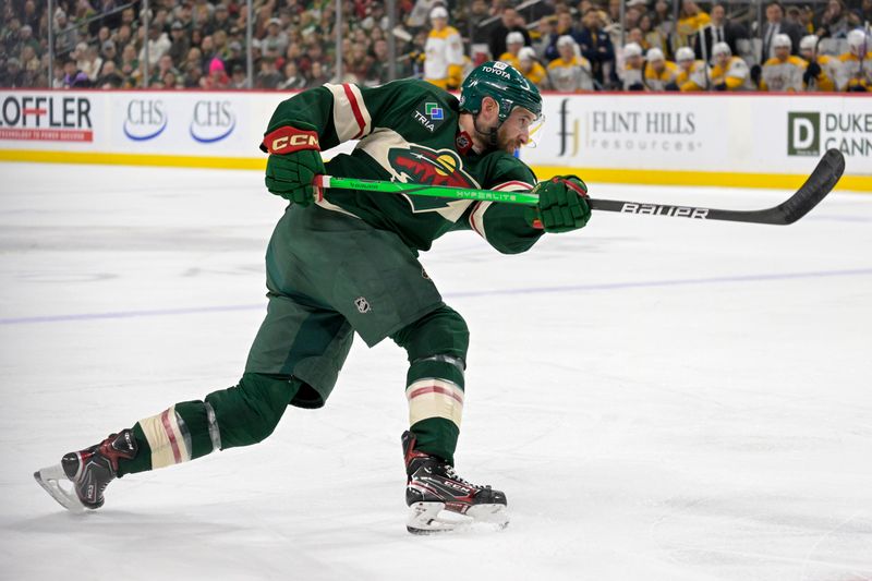 Jan 25, 2024; Saint Paul, Minnesota, USA; Minnesota Wild defenseman Alex Goligoski (33) takes a shot on goal against the Nashville Predators during the second period at Xcel Energy Center. Mandatory Credit: Nick Wosika-USA TODAY Sports