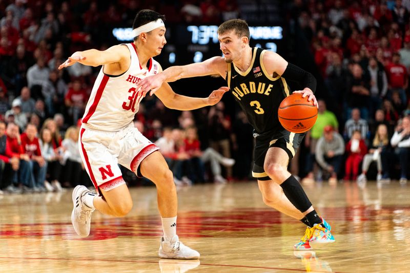 Jan 9, 2024; Lincoln, Nebraska, USA; Purdue Boilermakers guard Braden Smith (3) drives against Nebraska Cornhuskers guard Keisei Tominaga (30) during the second half at Pinnacle Bank Arena. Mandatory Credit: Dylan Widger-USA TODAY Sports