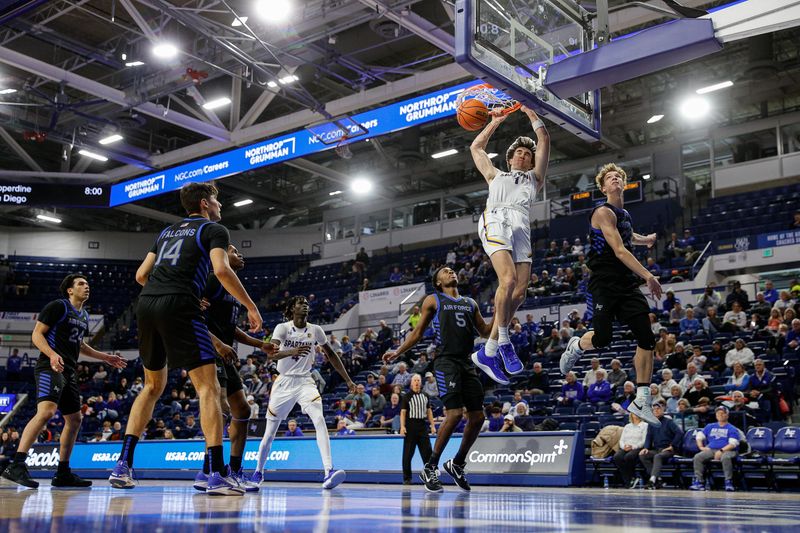 Jan 13, 2024; Colorado Springs, Colorado, USA; San Jose State Spartans guard Garrett Anderson (1) dunks the ball against Air Force Falcons guard Kellan Boylan (23) as forward Beau Becker (14) and center Adrame Diongue (4) and guard Ethan Taylor (5) look on in the first half at Clune Arena. Mandatory Credit: Isaiah J. Downing-USA TODAY Sports