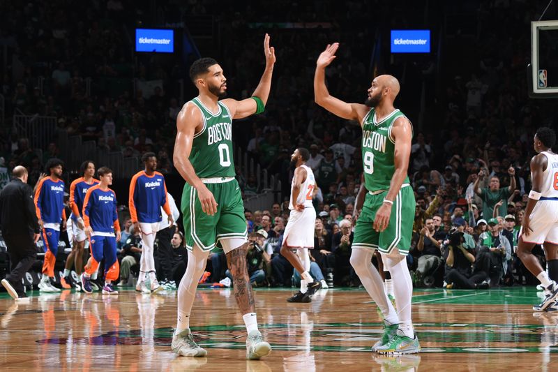 BOSTON, MA - OCTOBER 22: Jayson Tatum #0 and Derrick White #9 of the Boston Celtics high five during the game against the New York Knicks on October 22, 2024 at TD Garden in Boston, Massachusetts. NOTE TO USER: User expressly acknowledges and agrees that, by downloading and/or using this Photograph, user is consenting to the terms and conditions of the Getty Images License Agreement. Mandatory Copyright Notice: Copyright 2024 NBAE (Photo by Brian Babineau/NBAE via Getty Images)