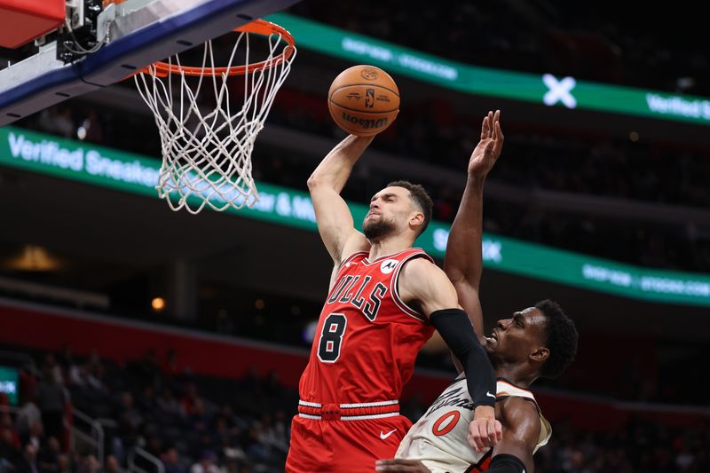 DETROIT, MICHIGAN - NOVEMBER 18: Zach LaVine #8 of the Chicago Bulls drives to the basket past Jalen Duren #0 of the Detroit Pistons during the second half at Little Caesars Arena on November 18, 2024 in Detroit, Michigan. Chicago won the game 122-112. NOTE TO USER: User expressly acknowledges and agrees that, by downloading and or using this photograph, User is consenting to the terms and conditions of the Getty Images License. (Photo by Gregory Shamus/Getty Images)