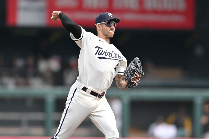 Aug 20, 2023; Minneapolis, Minnesota, USA; Minnesota Twins shortstop Carlos Correa (4) makes a putout against the Pittsburgh Pirates during the third inning at Target Field. Mandatory Credit: Jeffrey Becker-USA TODAY Sports