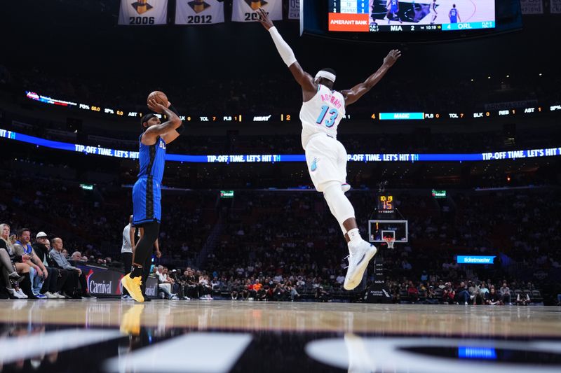 MIAMI, FLORIDA - JANUARY 27: Paolo Banchero #5 of the Orlando Magic goes up for a shot against Bam Adebayo #13 of the Miami Heat /during the first quarter at Kaseya Center on January 27, 2025 in Miami, Florida. NOTE TO USER: User expressly acknowledges and agrees that, by downloading and or using this photograph, User is consenting to the terms and conditions of the Getty Images License Agreement. (Photo by Rich Storry/Getty Images)