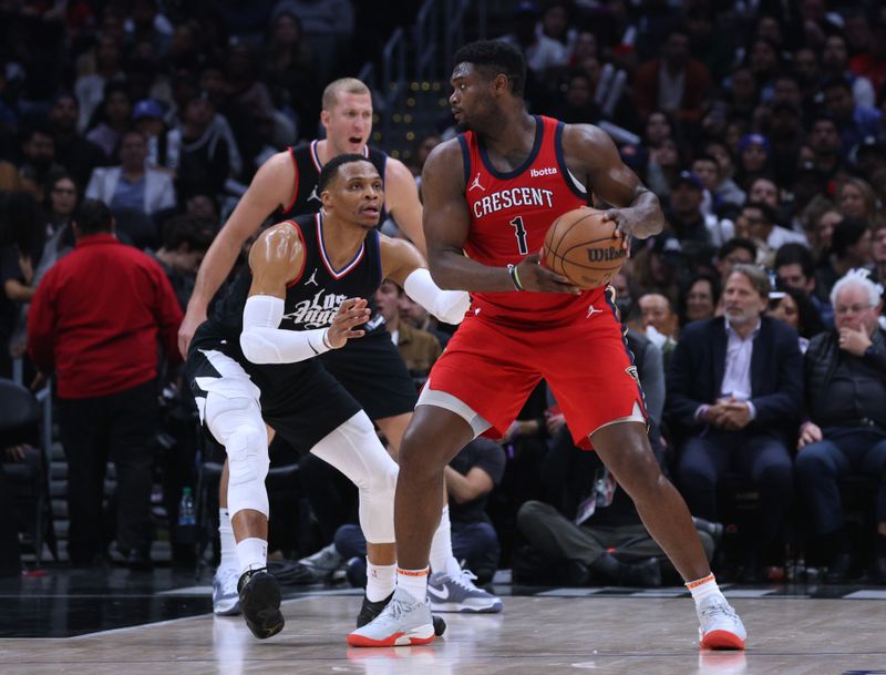 LOS ANGELES, CALIFORNIA - FEBRUARY 07: Zion Williamson #1 of the New Orleans Pelicans posts up Russell Westbrook #0 of the LA Clippers during a 117-106 New Orleans Pelicans win at Crypto.com Arena on February 07, 2024 in Los Angeles, California. NOTE TO USER: User expressly acknowledges and agrees that, by downloading and/or using this Photograph, user is consenting to the terms and conditions of the Getty Images License Agreement. (Photo by Harry How/Getty Images)