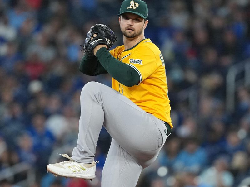 May 31, 2025; Toronto, Ontario, CAN; Athletics starting pitcher Gunnar Hoglund (53) throws a pitch against the Toronto Blue Jays during the first inning at Rogers Centre. Mandatory Credit: Nick Turchiaro-Imagn Images