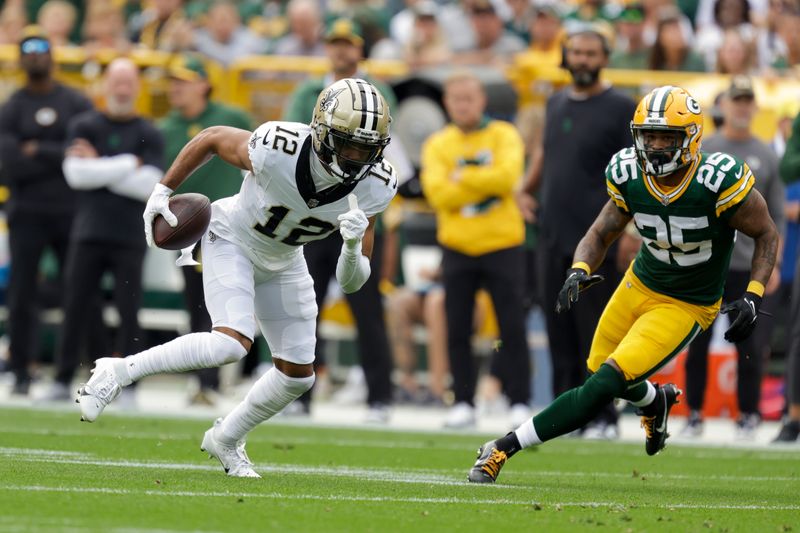 New Orleans Saints wide receiver Chris Olave (12) runs after making a catch during an NFL football game between the Green Bay Packers and New Orleans Saints Sunday, Sept. 24, 2023, in Green Bay, Wis. (AP Photo/Matt Ludtke)