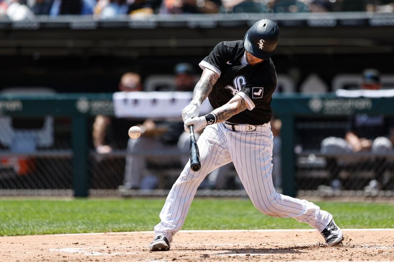 Jun 10, 2023; Chicago, Illinois, USA; Chicago White Sox catcher Yasmani Grandal (24) hits a double against the Miami Marlins during the second inning at Guaranteed Rate Field. Mandatory Credit: Kamil Krzaczynski-USA TODAY Sports