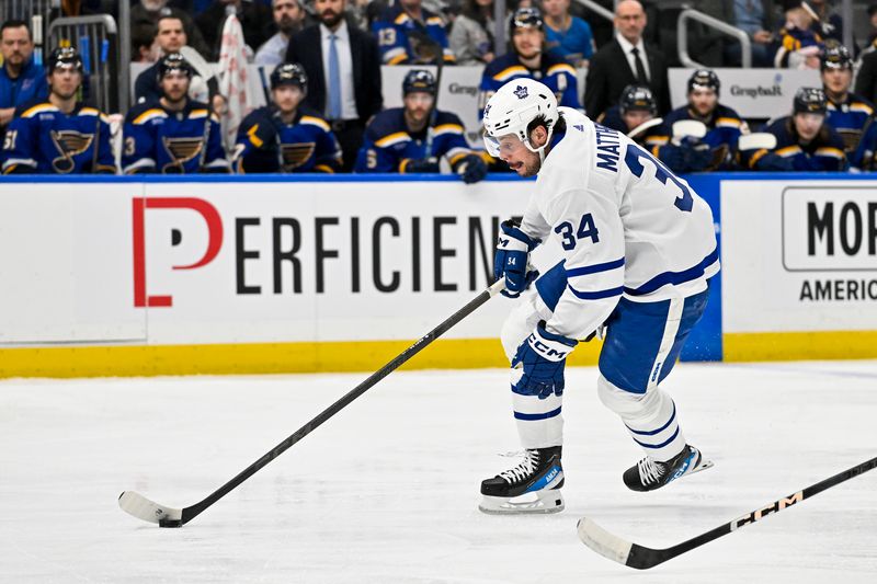 Feb 19, 2024; St. Louis, Missouri, USA;  Toronto Maple Leafs center Auston Matthews (34) controls the puck against the St. Louis Blues during the first period at Enterprise Center. Mandatory Credit: Jeff Curry-USA TODAY Sports