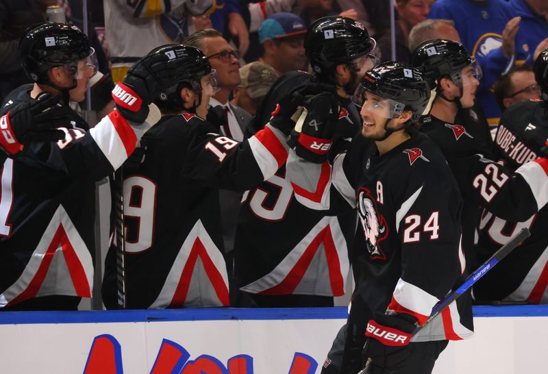 Nov 1, 2024; Buffalo, New York, USA;  Buffalo Sabres center Dylan Cozens (24) celebrates his goal with teammates during the first period against the New York Islanders at KeyBank Center. Mandatory Credit: Timothy T. Ludwig-Imagn Images