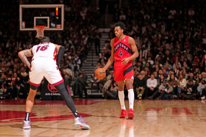 TORONTO, CANADA - JANUARY 17: Scottie Barnes #4 of the Toronto Raptors dribbles the ball during the game against the Miami Heat on January 17, 2024 at the Scotiabank Arena in Toronto, Ontario, Canada.  NOTE TO USER: User expressly acknowledges and agrees that, by downloading and or using this Photograph, user is consenting to the terms and conditions of the Getty Images License Agreement.  Mandatory Copyright Notice: Copyright 2024 NBAE (Photo by Mark Blinch/NBAE via Getty Images)