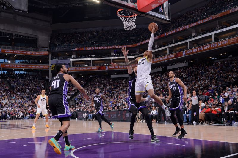 SACRAMENTO, CA - MARCH 31: Keyonte George #3 of the Utah Jazz drives to the basket during the game against the Sacramento Kings on March 31, 2024 at Golden 1 Center in Sacramento, California. NOTE TO USER: User expressly acknowledges and agrees that, by downloading and or using this Photograph, user is consenting to the terms and conditions of the Getty Images License Agreement. Mandatory Copyright Notice: Copyright 2024 NBAE (Photo by Rocky Widner/NBAE via Getty Images)