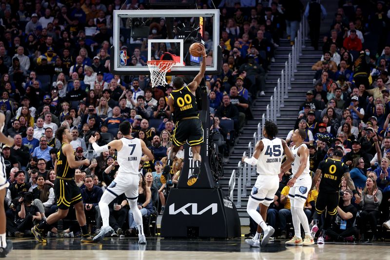 SAN FRANCISCO, CALIFORNIA - MARCH 20: Jonathan Kuminga #00 of the Golden State Warriors dunks the ball against the Memphis Grizzlies in the second half at Chase Center on March 20, 2024 in San Francisco, California. NOTE TO USER: User expressly acknowledges and agrees that, by downloading and or using this photograph, User is consenting to the terms and conditions of the Getty Images License Agreement.  (Photo by Ezra Shaw/Getty Images)