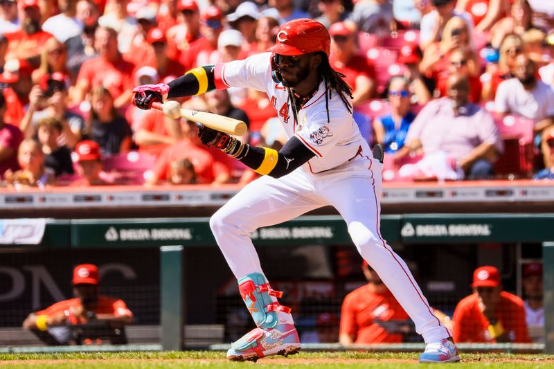 Sep 1, 2024; Cincinnati, Ohio, USA; Cincinnati Reds shortstop Elly De La Cruz (44) bunts against the Milwaukee Brewers in the first inning at Great American Ball Park. Mandatory Credit: Katie Stratman-USA TODAY Sports