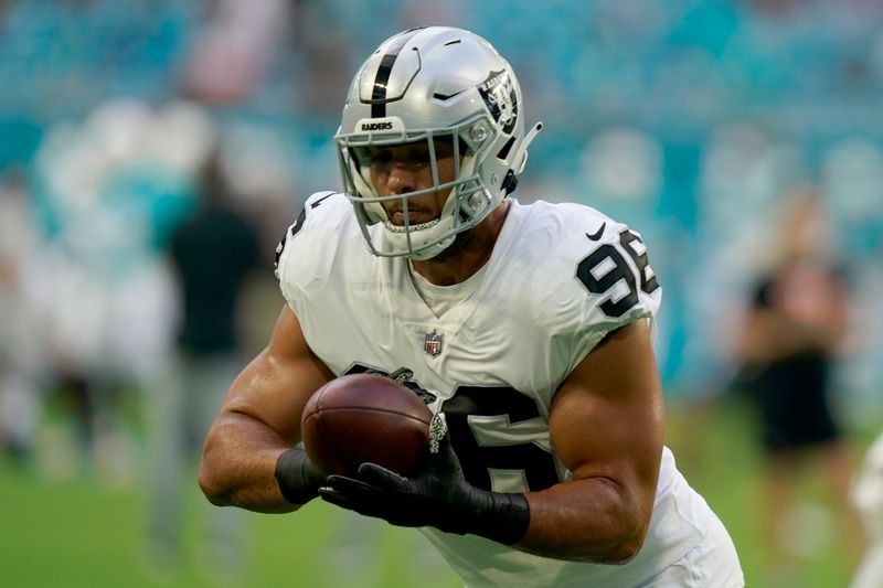 Las Vegas Raiders defensive end Tashawn Bower (96) does drills before a NFL preseason football game against the Miami Dolphins, Saturday, Aug. 20, 2022, in Miami Gardens, Fla. (AP Photo/Lynne Sladky)