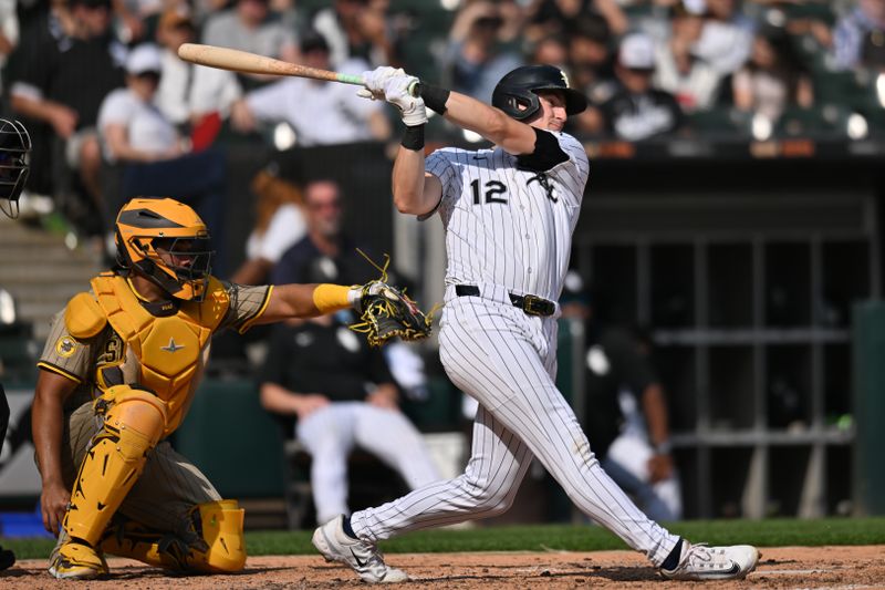 Sep 21, 2025; Chicago, Illinois, USA; Chicago White Sox shortstop Colson Montgomery (12) hits a single against the San Diego Padres during the sixth inning at Rate Field. Mandatory Credit: Patrick Gorski-Imagn Images