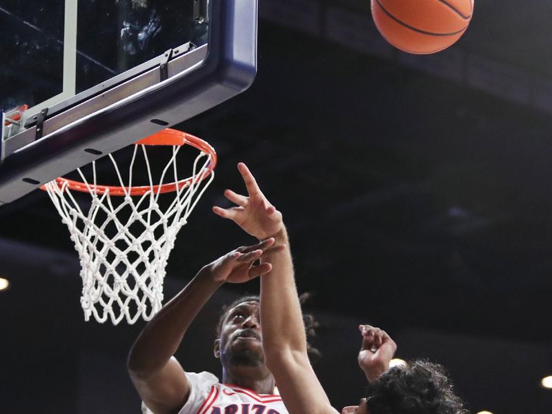 Feb 18, 2023; Tucson, Arizona, USA; Arizona Wildcats guard Cedric Henderson Jr. (45) blocks a shot against Colorado Buffaloes guard Julian Hammond III (1) during the first half at McKale Center. Mandatory Credit: Zachary BonDurant-USA TODAY Sports