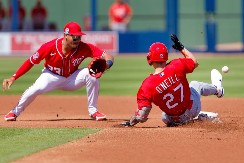 Feb 28, 2023; West Palm Beach, Florida, USA; St. Louis Cardinals left fielder Tyler O'Neill (27) slides into second base during the first inning against the Washington Nationals at The Ballpark of the Palm Beaches. Mandatory Credit: Sam Navarro-USA TODAY Sports