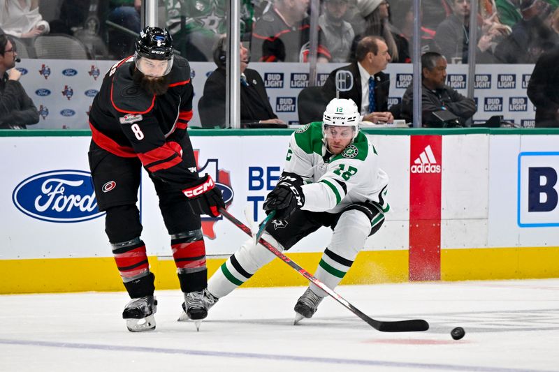 Jan 25, 2023; Dallas, Texas, USA; Carolina Hurricanes defenseman Brent Burns (8) and Dallas Stars center Radek Faksa (12) chase the puck during the second period at the American Airlines Center. Mandatory Credit: Jerome Miron-USA TODAY Sports