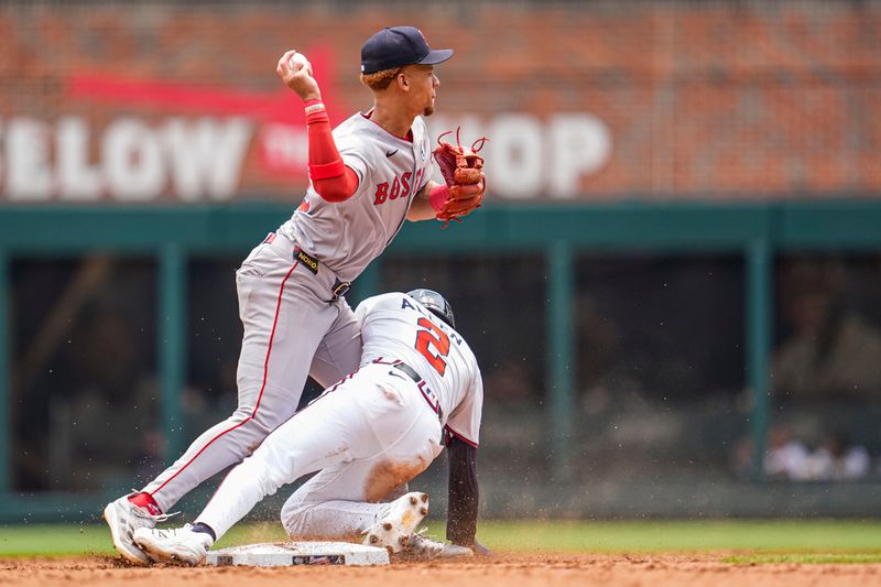Jun 1, 2025; Cumberland, Georgia, USA; Boston Red Sox second baseman Kristian Campbell (28) is hit by Atlanta Braves shortstop Nick Allen (2) while trying to throw during the fifth inning at Truist Park. Mandatory Credit: Dale Zanine-Imagn Images