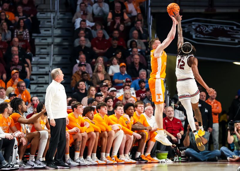 Mar 6, 2024; Columbia, South Carolina, USA; Tennessee Volunteers head coach Rick Barnes looks on as guard Dalton Knecht (3) makes a three point basket while being fouled by South Carolina Gamecocks guard Zachary Davis (12) in the second half at Colonial Life Arena. Mandatory Credit: Jeff Blake-USA TODAY Sports