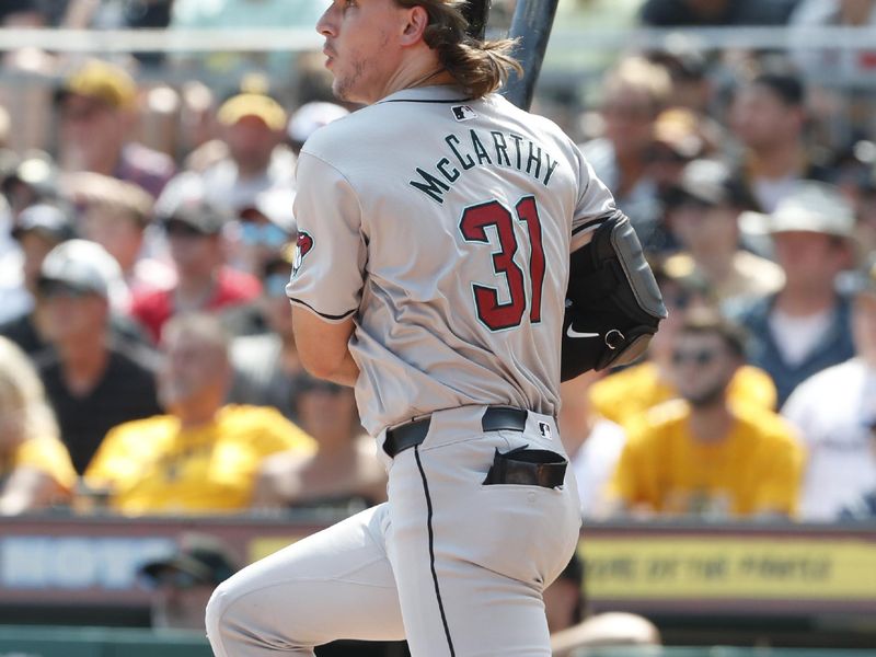 Aug 4, 2024; Pittsburgh, Pennsylvania, USA;  Arizona Diamondbacks left fielder Jake McCarthy (31) hits an RBI single against the Pittsburgh Pirates during the sixth inning at PNC Park. Mandatory Credit: Charles LeClaire-USA TODAY Sports