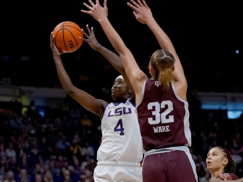 Jan 11, 2024; Baton Rouge, Louisiana, USA; LSU Lady Tigers guard Flau'jae Johnson (4) shoots against Texas A&M Aggies forward Lauren Ware (32) during the second half at Pete Maravich Assembly Center. Mandatory Credit: Matthew Hinton-USA TODAY Sports