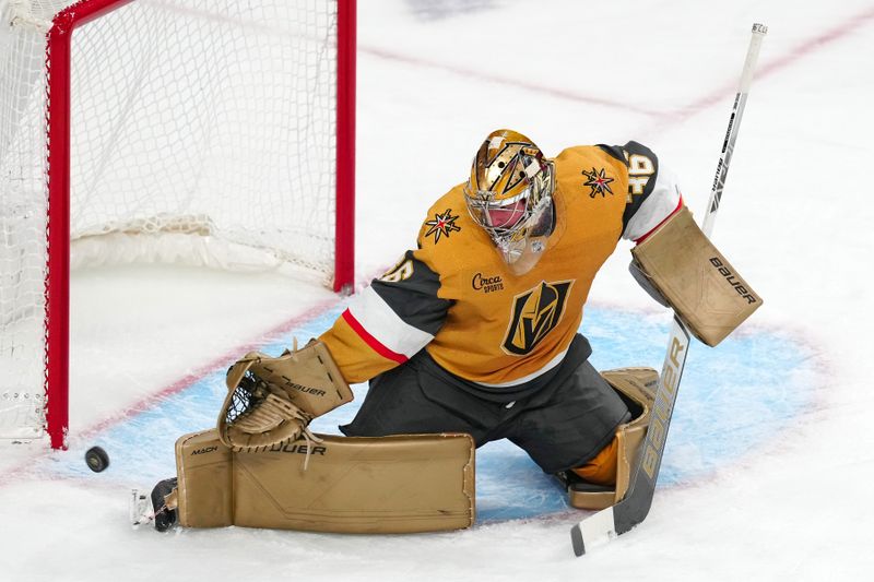 Dec 2, 2023; Las Vegas, Nevada, USA; Vegas Golden Knights goaltender Logan Thompson (36) makes a skate save against the Washington Capitals during the third period at T-Mobile Arena. Mandatory Credit: Stephen R. Sylvanie-USA TODAY Sports