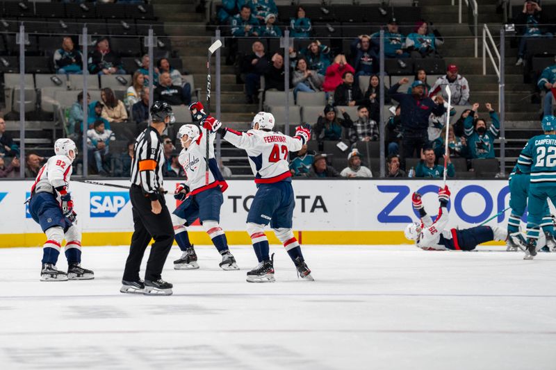 Nov 27, 2023; San Jose, California, USA; Washington Capitals center Evgeny Kuznetsov (92) and Washington Capitals defenseman Martin Fehervary (42) and teammates celebrate after the goal against the San Jose Sharks during the second period at SAP Center at San Jose. Mandatory Credit: Neville E. Guard-USA TODAY Sports