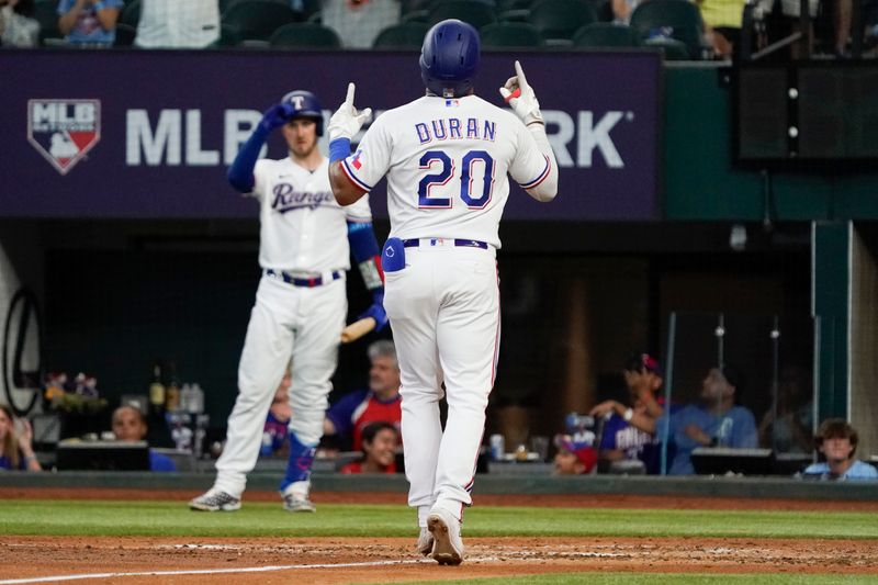 Jun 29, 2023; Arlington, Texas, USA; Texas Rangers shortstop Ezequiel Duran (20) rounds the bases after hitting a solo home run during the fourth inning against the Detroit Tigers at Globe Life Field. Mandatory Credit: Raymond Carlin III-USA TODAY Sports