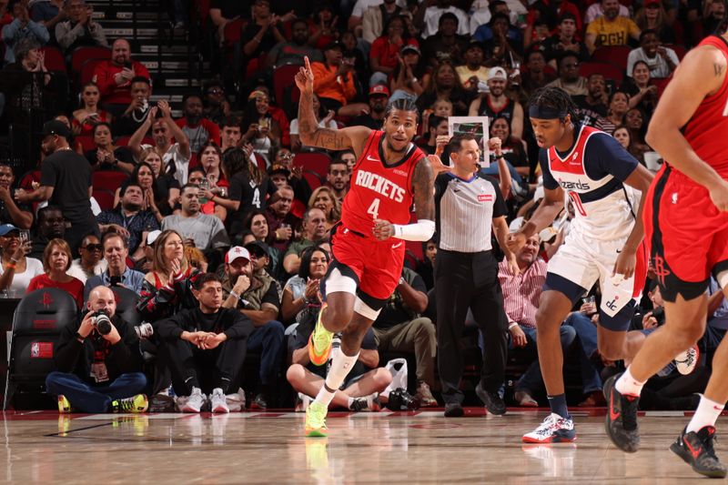 HOUSTON, TX - NOVEMBER 11: Jalen Green #4 of the Houston Rockets celebrates during the game against the Washington Wizards on November 11, 2024 at the Toyota Center in Houston, Texas. NOTE TO USER: User expressly acknowledges and agrees that, by downloading and or using this photograph, User is consenting to the terms and conditions of the Getty Images License Agreement. Mandatory Copyright Notice: Copyright 2024 NBAE (Photo by KeShawn Ennis/NBAE via Getty Images)