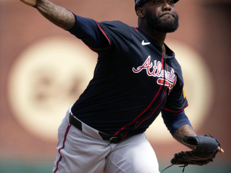 Jun 8, 2025; San Francisco, California, USA; Atlanta Braves pitcher Enyel De Los Santos (61) delivers a pitch against the San Francisco Giants during the eighth inning at Oracle Park. Mandatory Credit: D. Ross Cameron-Imagn Images
