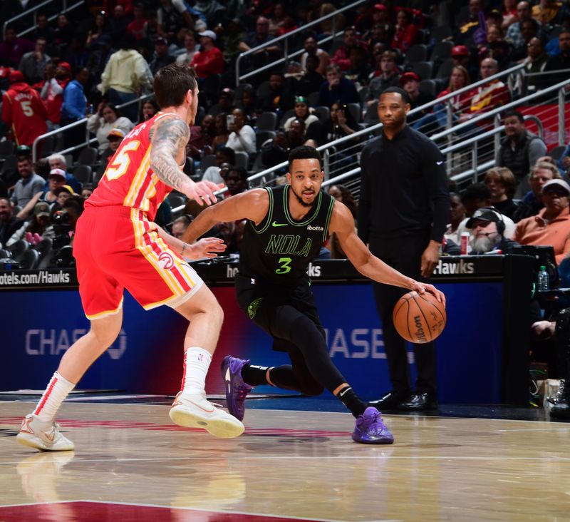 ATLANTA, GA - MARCH 10: CJ McCollum #3 of the New Orleans Pelicans dribbles the ball during the game against the Atlanta Hawks on March 10, 2024 at State Farm Arena in Atlanta, Georgia.  NOTE TO USER: User expressly acknowledges and agrees that, by downloading and/or using this Photograph, user is consenting to the terms and conditions of the Getty Images License Agreement. Mandatory Copyright Notice: Copyright 2024 NBAE (Photo by Scott Cunningham/NBAE via Getty Images)