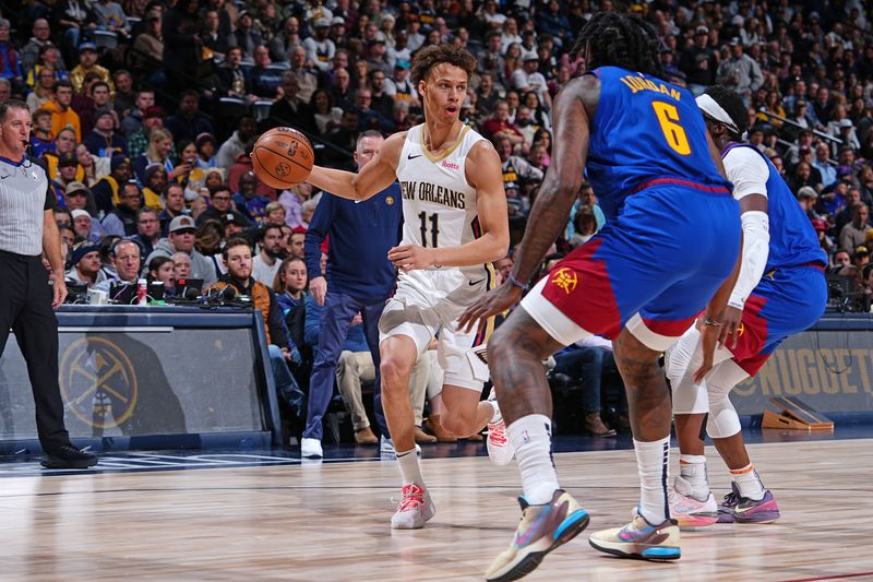 DENVER, CO - JANUARY 12: Dyson Daniels #11 of the New Orleans Pelicans dribbles the ball during the game against the Denver Nuggets on January 12, 2024 at the Ball Arena in Denver, Colorado. NOTE TO USER: User expressly acknowledges and agrees that, by downloading and/or using this Photograph, user is consenting to the terms and conditions of the Getty Images License Agreement. Mandatory Copyright Notice: Copyright 2024 NBAE (Photo by Garrett Ellwood/NBAE via Getty Images)