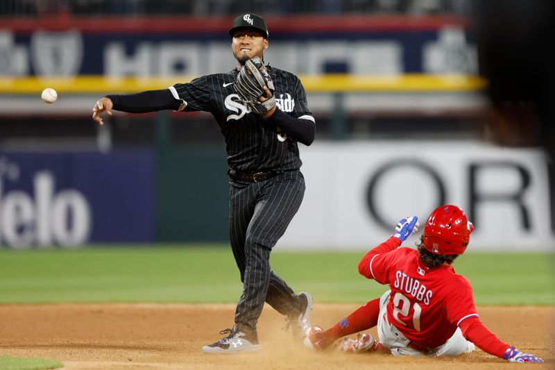 Apr 18, 2023; Chicago, Illinois, USA; Chicago White Sox shortstop Lenyn Sosa (50) throws to first base after forcing out Philadelphia Phillies catcher Garrett Stubbs (21) at second base during the sixth inning of game two of the doubleheader at Guaranteed Rate Field. Mandatory Credit: Kamil Krzaczynski-USA TODAY Sports