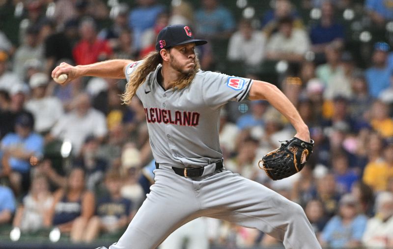 Aug 16, 2024; Milwaukee, Wisconsin, USA; Cleveland Guardians pitcher Scott Barlow (58) delivers  pitch against the Milwaukee Brewers in the eighth inning at American Family Field. Mandatory Credit: Michael McLoone-USA TODAY Sports