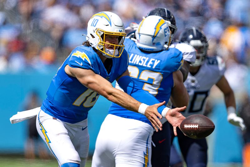 Los Angeles Chargers quarterback Justin Herbert (10) pitches the ball during their NFL football game against the Tennessee Titans Sunday, Sept. 17, 2023, in Nashville, Tenn. (AP Photo/Wade Payne)