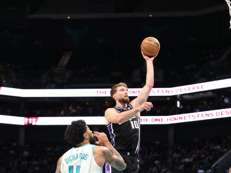 CHARLOTTE, NC - JANUARY 10: Domantas Sabonis #10 of the Sacramento Kings drives to the basket during the game against the Charlotte Hornets on January  10, 2024 at Spectrum Center in Charlotte, North Carolina. NOTE TO USER: User expressly acknowledges and agrees that, by downloading and or using this photograph, User is consenting to the terms and conditions of the Getty Images License Agreement.  Mandatory Copyright Notice:  Copyright 2024 NBAE (Photo by Brock Williams-Smith/NBAE via Getty Images) 