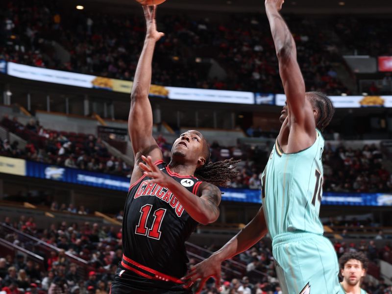 CHICAGO, IL - DECEMBER 13: Ayo Dosunmu #11 of the Chicago Bulls shoots the ball during the game against the Charlotte Hornets on December 13, 2024 at United Center in Chicago, Illinois. NOTE TO USER: User expressly acknowledges and agrees that, by downloading and or using this photograph, User is consenting to the terms and conditions of the Getty Images License Agreement. Mandatory Copyright Notice: Copyright 2024 NBAE (Photo by Jeff Haynes/NBAE via Getty Images)