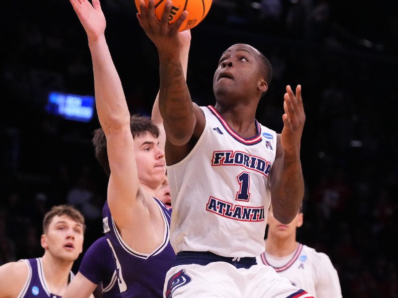 March 22, 2024, Brooklyn, NY, USA; Florida Atlantic Owls guard Johnell Davis (1) shoots against Northwestern Wildcats guard Brooks Barnhizer (13) in the first round of the 2024 NCAA Tournament at the Barclays Center. Mandatory Credit: Robert Deutsch-USA TODAY Sports