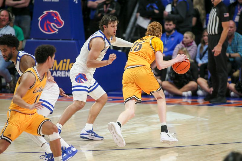 Feb 11, 2023; Boise, Idaho, USA; Wyoming Cowboys forward Nate Barnhart (15)  dribbles against Boise State Broncos forward Tyson Degenhart (2) during the second half at ExtraMile Arena. Boise State beats Wyoming 75-63. Mandatory Credit: Brian Losness-USA TODAY Sports
