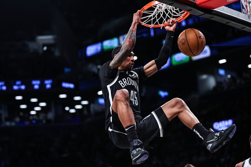 NEW YORK, NEW YORK - DECEMBER 27: Keon Johnson #45 of the Brooklyn Nets dunks the ball during the third quarter of the game against the Milwaukee Bucks at Barclays Center on December 27, 2023 in New York City. NOTE TO USER: User expressly acknowledges and agrees that, by downloading and or using this photograph, User is consenting to the terms and conditions of the Getty Images License Agreement. (Photo by Dustin Satloff/Getty Images)