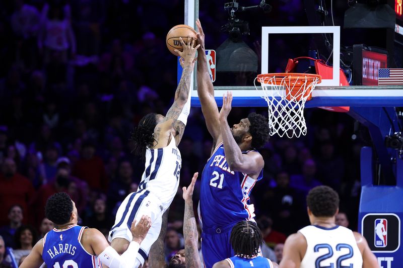 PHILADELPHIA, PENNSYLVANIA - FEBRUARY 23: Joel Embiid #21 of the Philadelphia 76ers blocks Ja Morant #12 of the Memphis Grizzlies during the fourth quarter at Wells Fargo Center on February 23, 2023 in Philadelphia, Pennsylvania. NOTE TO USER: User expressly acknowledges and agrees that, by downloading and or using this photograph, User is consenting to the terms and conditions of the Getty Images License Agreement. (Photo by Tim Nwachukwu/Getty Images)