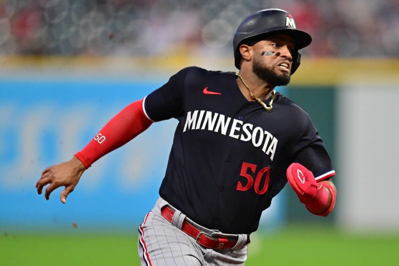 Sep 5, 2023; Cleveland, Ohio, USA; Minnesota Twins center fielder Willi Castro (50) advances to third on a hit by pinch hitter Kyle Farmer (12) during the sixth inning against the Cleveland Guardians at Progressive Field. Mandatory Credit: Ken Blaze-USA TODAY Sports