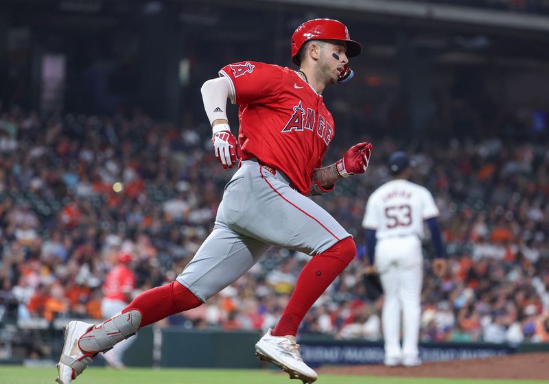 May 21, 2024; Houston, Texas, USA; Los Angeles Angels shortstop Zach Neto (9) runs on an RBI double during the fourth inning against the Houston Astros at Minute Maid Park. Mandatory Credit: Troy Taormina-USA TODAY Sports