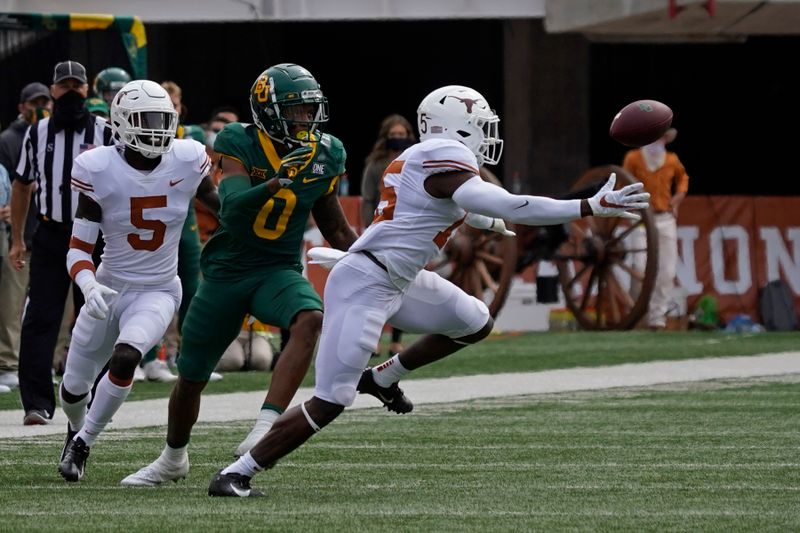 Oct 24, 2020; Austin, Texas, USA; Texas Longhorns defensive back Chris Brown (15) breaks up a pass intended for Baylor Bears wide receiver R.J. Sneed (00) in the first quarter at Darrell K Royal-Texas Memorial Stadium. Mandatory Credit: Scott Wachter-USA TODAY Sports